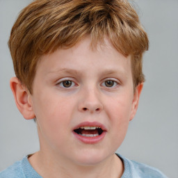 Joyful white child male with short  brown hair and blue eyes