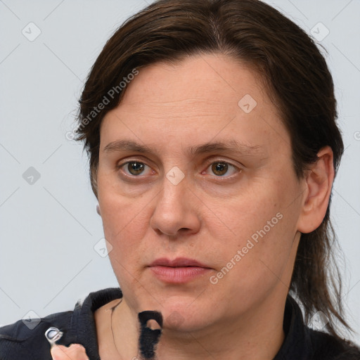 Joyful white adult female with medium  brown hair and grey eyes