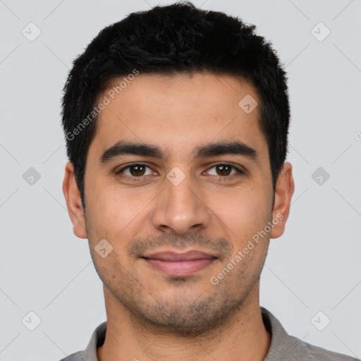 Joyful latino young-adult male with short  black hair and brown eyes