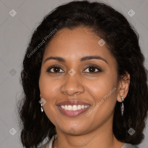 Joyful black young-adult female with medium  brown hair and brown eyes