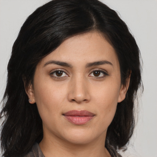 Joyful asian young-adult female with medium  brown hair and brown eyes