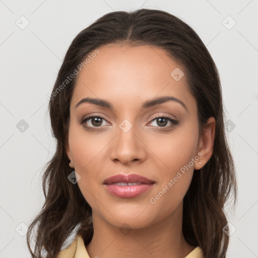 Joyful latino young-adult female with medium  brown hair and brown eyes