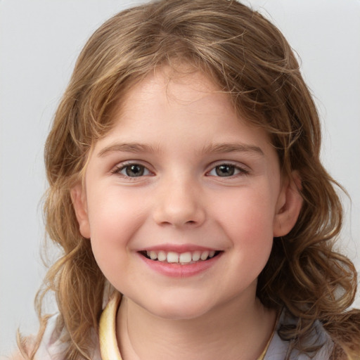 Joyful white child female with medium  brown hair and brown eyes