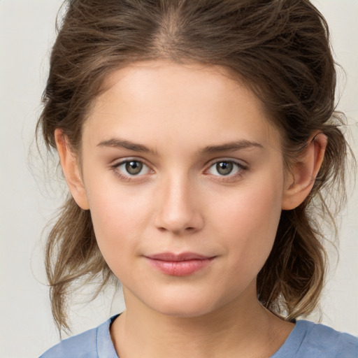 Joyful white child female with medium  brown hair and brown eyes