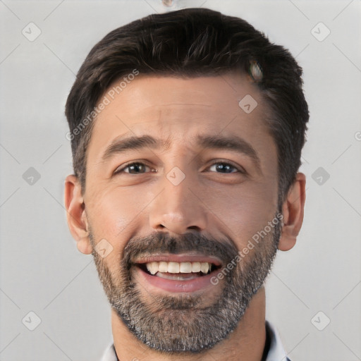 Joyful white young-adult male with short  black hair and brown eyes