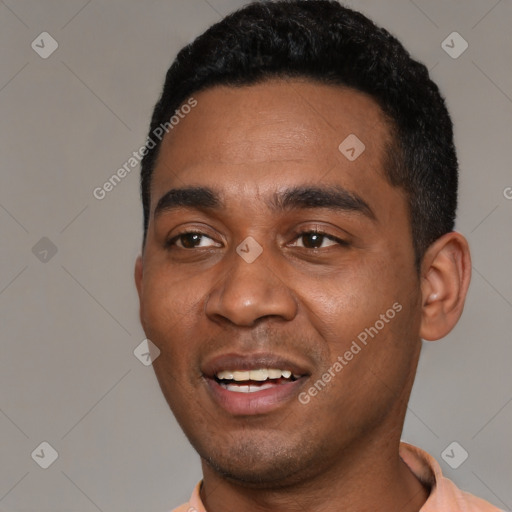 Joyful black young-adult male with short  black hair and brown eyes