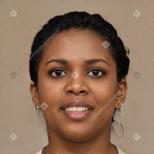 Joyful black young-adult female with short  black hair and brown eyes