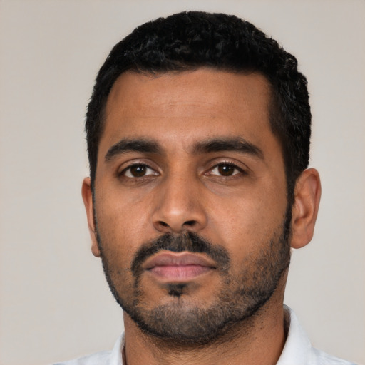 Neutral latino young-adult male with short  black hair and brown eyes