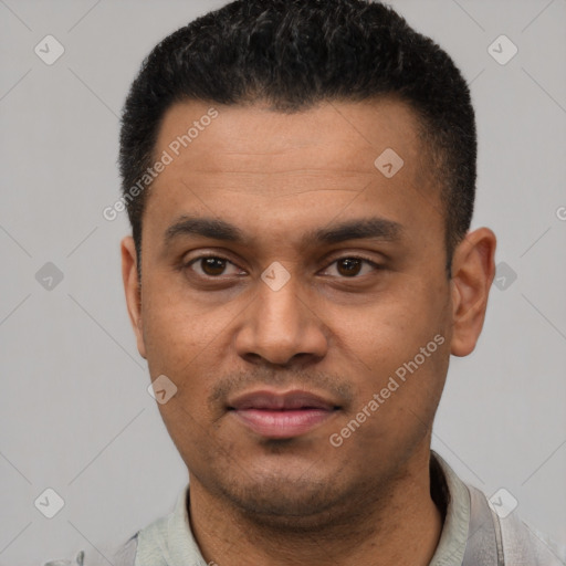 Joyful latino young-adult male with short  black hair and brown eyes