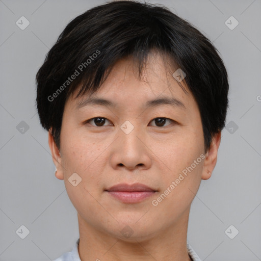 Joyful asian young-adult male with short  brown hair and brown eyes