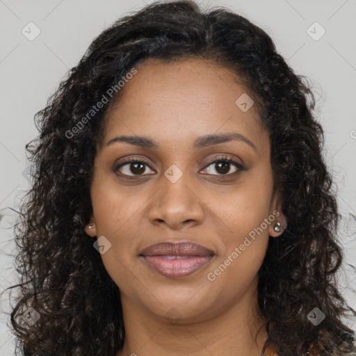 Joyful black young-adult female with long  brown hair and brown eyes