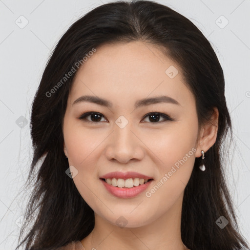 Joyful asian young-adult female with long  brown hair and brown eyes