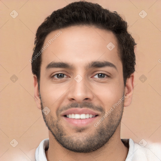 Joyful white young-adult male with short  black hair and brown eyes