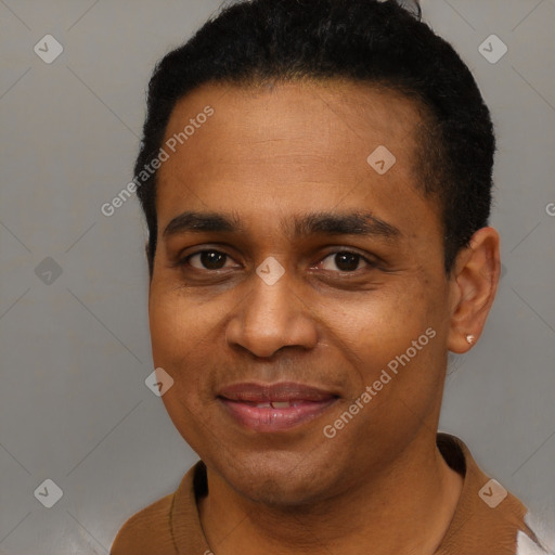 Joyful black young-adult male with short  black hair and brown eyes