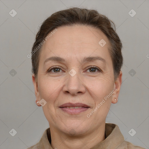 Joyful white adult female with short  brown hair and brown eyes