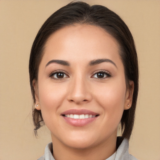 Joyful white young-adult female with medium  brown hair and brown eyes