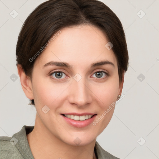 Joyful white young-adult female with short  brown hair and grey eyes