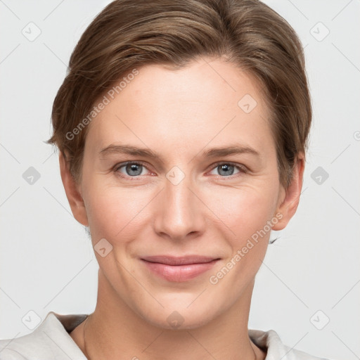 Joyful white young-adult female with short  brown hair and grey eyes