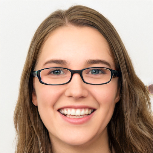 Joyful white young-adult female with long  brown hair and green eyes