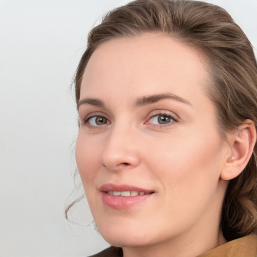 Joyful white young-adult female with medium  brown hair and blue eyes