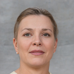 Joyful white adult female with short  brown hair and grey eyes