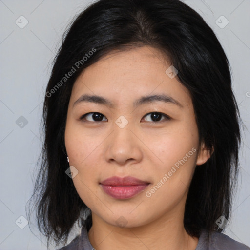 Joyful asian young-adult female with medium  black hair and brown eyes