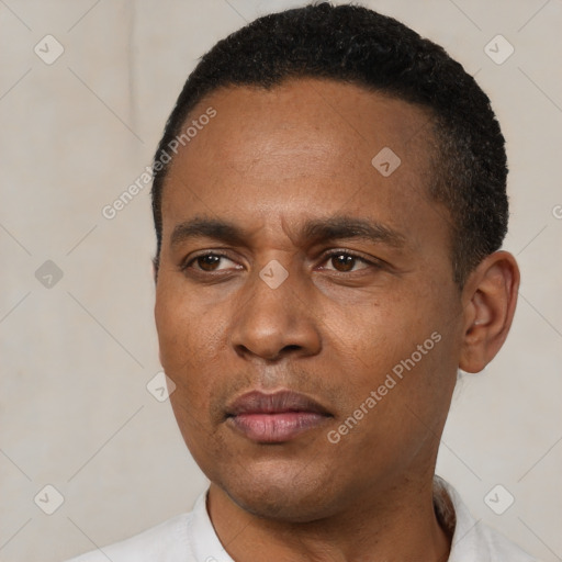 Neutral latino young-adult male with short  black hair and brown eyes