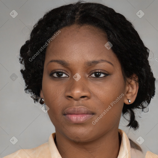 Joyful black young-adult female with medium  black hair and brown eyes