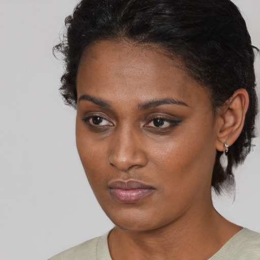 Neutral black young-adult female with medium  black hair and brown eyes