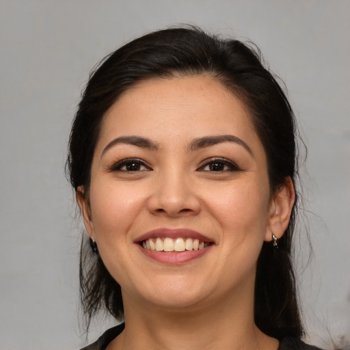 Joyful white young-adult female with medium  brown hair and brown eyes