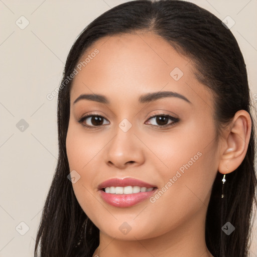 Joyful white young-adult female with long  brown hair and brown eyes