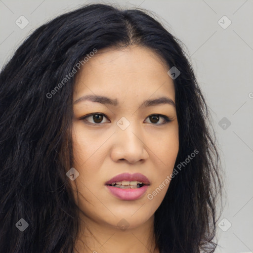 Joyful asian young-adult female with long  brown hair and brown eyes