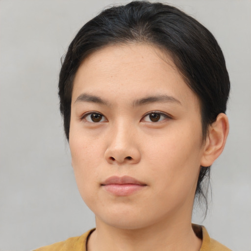 Neutral asian young-adult female with medium  brown hair and brown eyes