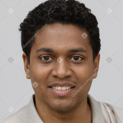 Joyful black young-adult male with short  black hair and brown eyes