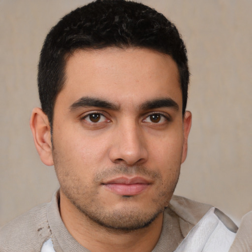 Neutral latino young-adult male with short  brown hair and brown eyes
