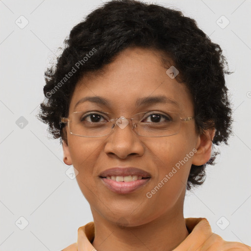 Joyful black adult female with short  brown hair and brown eyes