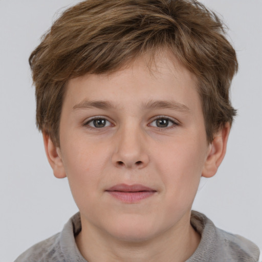 Joyful white child male with short  brown hair and grey eyes