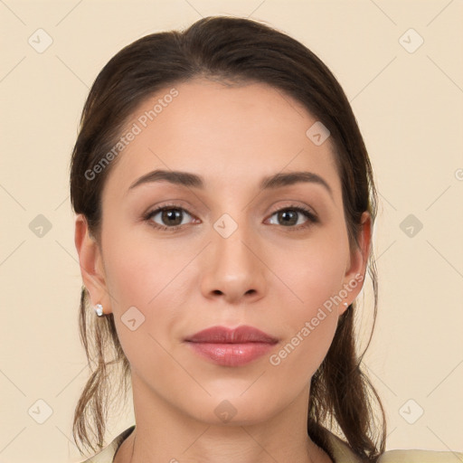 Joyful white young-adult female with long  brown hair and brown eyes