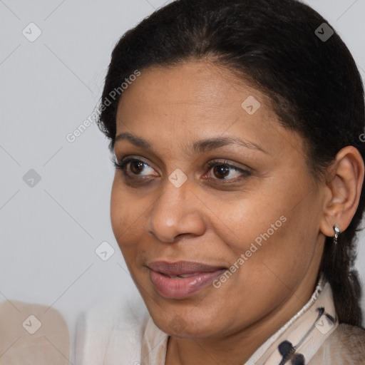 Joyful latino adult female with short  brown hair and brown eyes