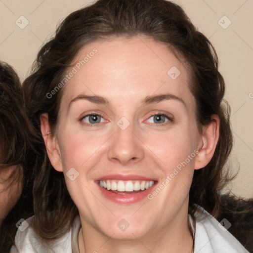 Joyful white young-adult female with medium  brown hair and blue eyes