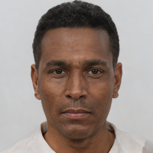 Neutral black adult male with short  black hair and brown eyes