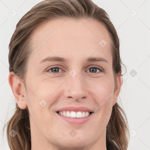 Joyful white young-adult female with long  brown hair and grey eyes