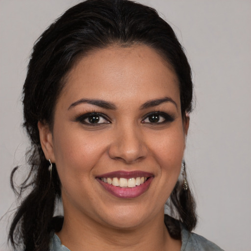 Joyful white young-adult female with medium  brown hair and brown eyes