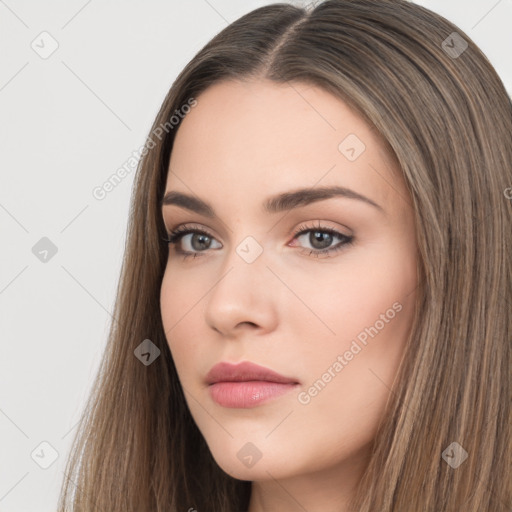 Neutral white young-adult female with long  brown hair and brown eyes