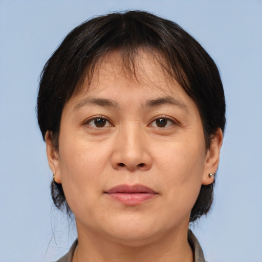 Joyful white adult female with short  brown hair and brown eyes