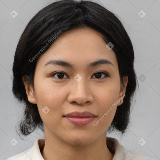 Joyful asian young-adult female with medium  black hair and brown eyes