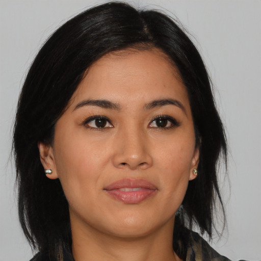 Joyful asian young-adult female with medium  black hair and brown eyes