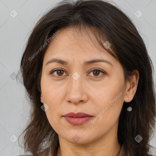 Joyful white adult female with long  brown hair and brown eyes