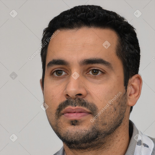 Neutral latino young-adult male with short  black hair and brown eyes