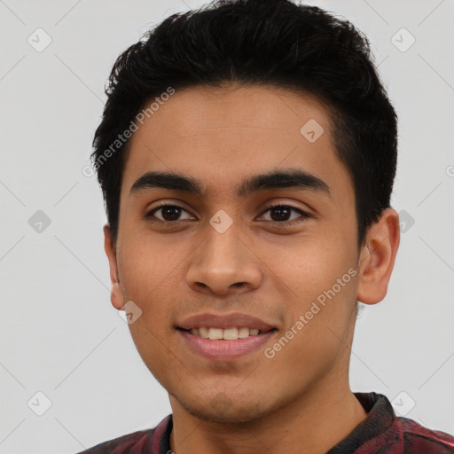 Joyful latino young-adult male with short  black hair and brown eyes